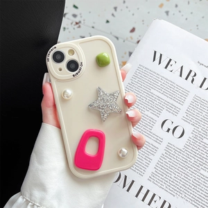 Detail of cream iPhone case with 3D stars, pearls and geometric block decorations