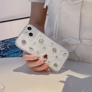 Sparkly iPhone case with colorful rhinestones and heart gems on pearlescent base