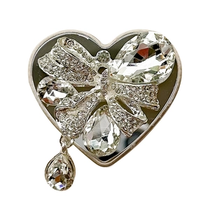 Luxury heart-shaped crystal phone grip with bow design and sparkling rhinestones