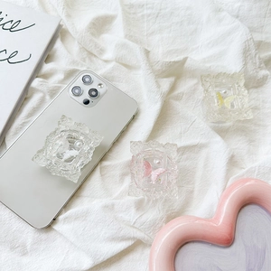 Colorful butterfly and pearl embossed frame retractable pop socket phone grip on white background