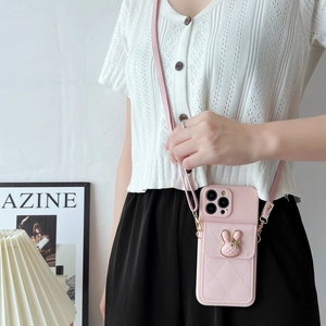 Pink quilted leather phone case with rabbit wallet and adjustable crossbody strap detail