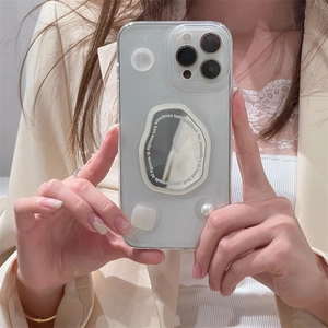 Transparent iPhone case with aesthetic irregular mirror and pearl detail, minimalist style