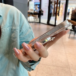 Detail of iPhone case with a retractable airbag stand featuring elegant white pearls