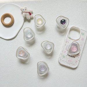 Detail of colorful aurora gem phone grip sockets with sparkling resin spherical design
