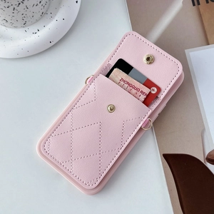 Detail of pink quilted leather iPhone case featuring a functional card wallet with snap button