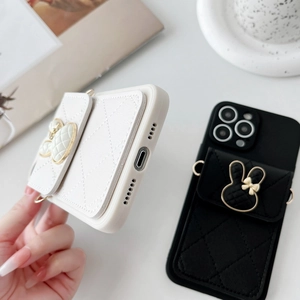Close-up of quilted leather iPhone case with rabbit metal decor and card holder slot