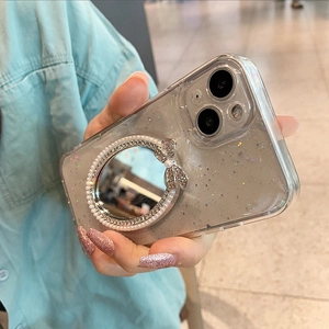 Close-up of clear iPhone case with glitter finish featuring a pearl-encrusted vanity mirror