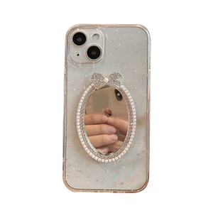 Clear glitter iPhone case with sparkling sequins, makeup mirror and pearl bow detail