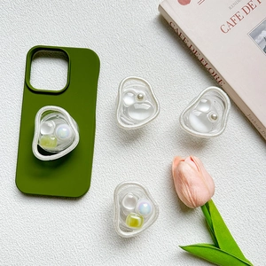 Deep green phone case with four matching pearl and gemstone collapsible socket grips