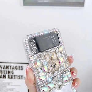 Detailed close-up of luxury rhinestone crystal bear ornament on Galaxy Z Flip case