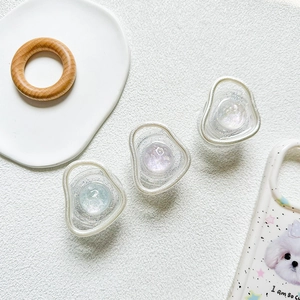 Detailed close-up of iridescent glitter gem phone grips in blue and purple colors