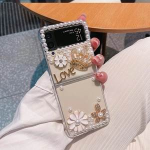 Clear case for Samsung Z Flip series with pearls, gold crown, and floral charms