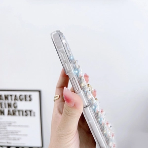 Detail of luxury rhinestone floral phone case for Samsung Z Flip 4 with handle ring