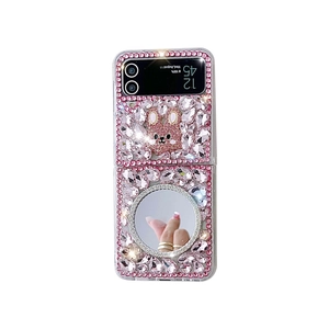 Pink rhinestone Samsung Galaxy Z Flip4 case with rabbit decor and vanity mirror