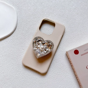 Luxury heart rhinestone and pearl phone grip on beige lychee leather case