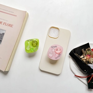 Minimalist resin gem phone grip stand with gift of future text on beige matte phone case