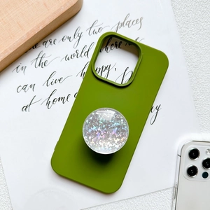 Green silicone phone case with holographic glitter expandable socket stand on wooden desk