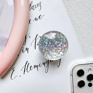 Detailed macro view of holographic pixel glitter phone grip with colorful rainbow effect