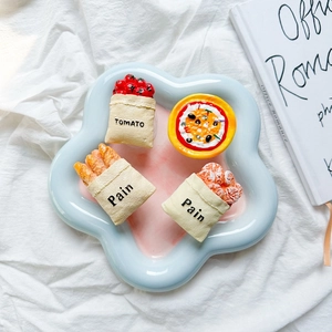 3D realistic pizza and bread bag phone sockets set on a light blue tray with white fabric