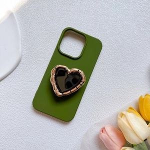 Matte dark green phone case with gold bamboo-textured heart-shaped expandable socket