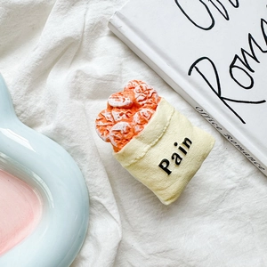 Close-up of creative French bread bag design phone grip with 3D realistic pastry details