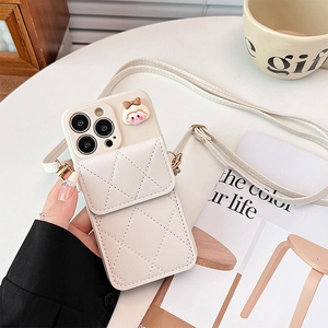 Quilted leather phone case for iPhone with crossbody strap and cute cartoon girl charm