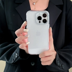 Minimalist transparent iPhone case with pink gradient frame held by a model in a black suit