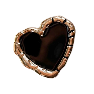 Metallic heart phone socket with gold textured edge and black glossy surface
