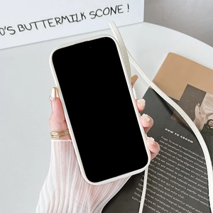 Detail of cream white iPhone case with adjustable crossbody lanyard strap for hands-free use