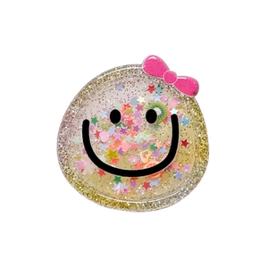 Cute smiley face glitter phone grip with sequins, pink bow, and fruit slices
