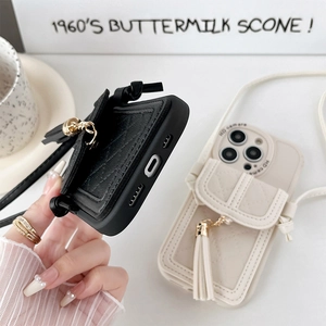 Quilted leather phone case with card wallet, fringe charm, and adjustable crossbody strap