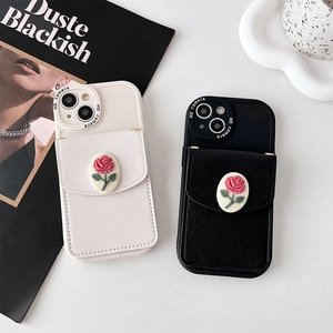 Detailed view of the embossed 3D rose pattern and lychee leather texture on the wallet case