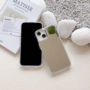 Macro shot of silver mirror iPhone case resting on minimalist artistic scene display