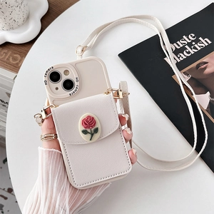 Detail showing cream iPhone case with 3D rose wallet and adjustable crossbody strap