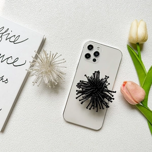 Unique hedgehog style pop socket phone grip in black and transparent white colors