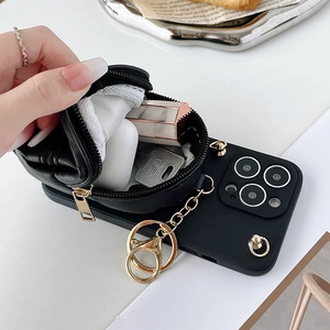 Detail of crossbody phone case with a functional leather zipper pouch for AirPods and keys