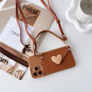 Caramel brown PU leather iPhone case with crossbody strap and heart-shaped wallet detail