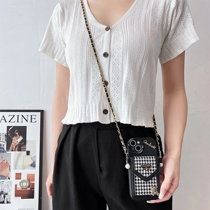 Crossbody phone case featuring houndstooth card pocket, gold chain strap and bear charm