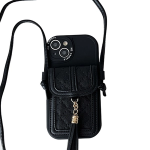 Black quilted leather iPhone case with adjustable crossbody strap and tassel charm