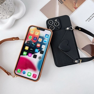 Detailed view of iPhone leather crossbody cases with heart-shaped wallet and shoulder straps