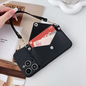 Close-up of black iPhone wallet case featuring a snap-button card slot and leather handle