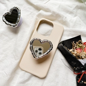 Off-white lychee leather phone case with silver heart mirror foldable stand on fabric