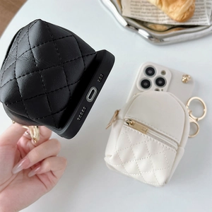 Detail view of iPhone leather case with quilted coin purse and golden zipper closure