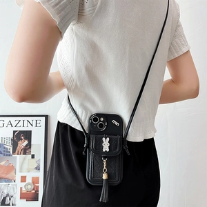 Back view of model wearing a black leather crossbody phone case with bunny crystal card slot
