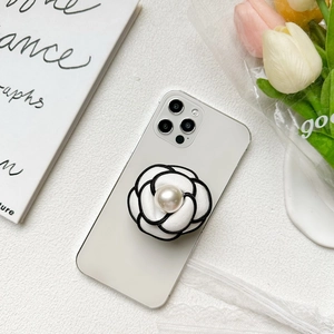 French camellia phone socket with pearl accent on white smartphone rear view