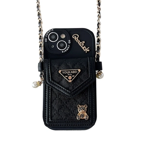 Quilted leather phone case for iPhone 16 with crossbody chain and bear ornament