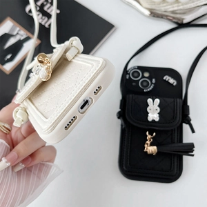 Detail of quilted leather phone case with pearl rabbit charm and chain shoulder strap