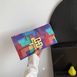 Colorful geometric block patterned clutch bag with elegant golden interlocking metal clasp
