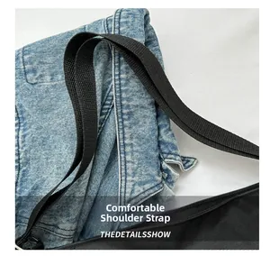 Detail of durable black nylon woven strap with adjustable metal buckle on canvas tote