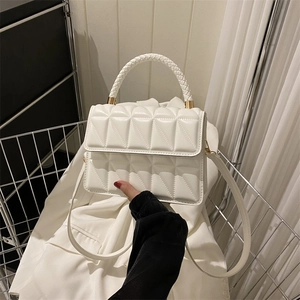 White geometric quilted shoulder bag with gold hardware and woven handle for women